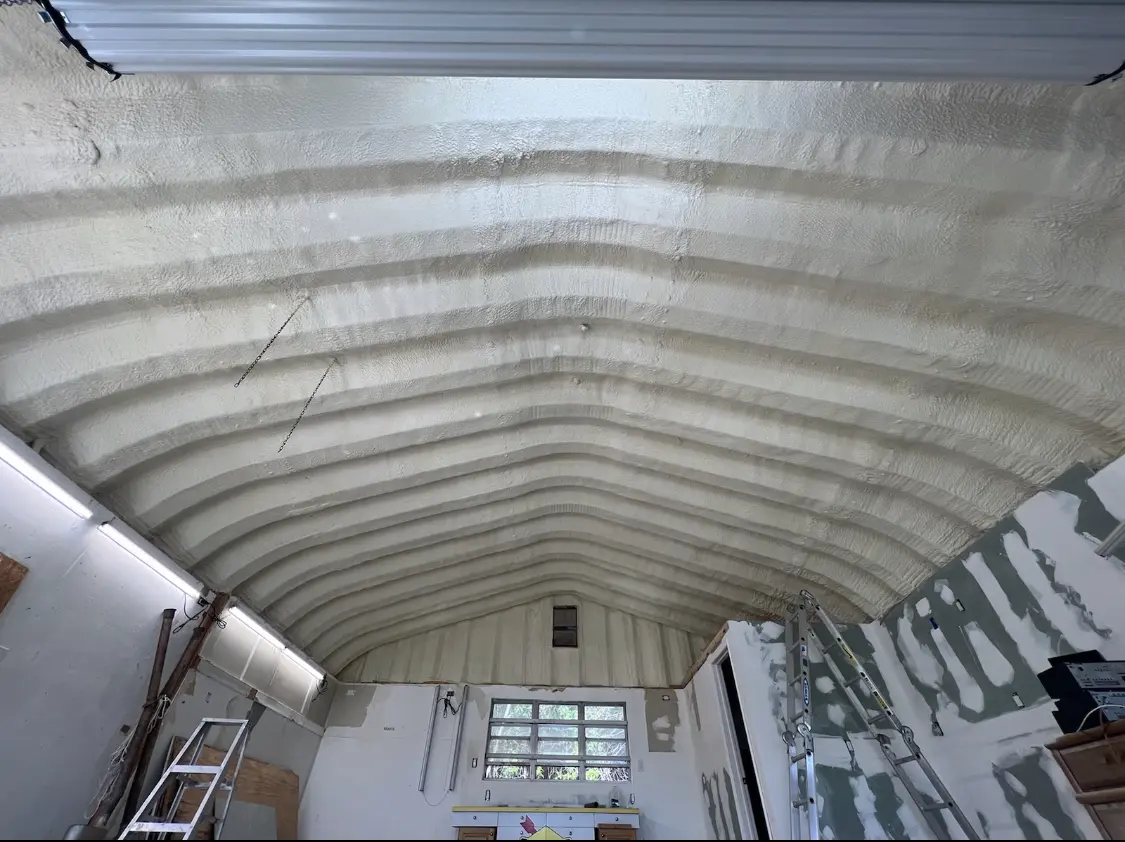 Spray polyurethane foam applied to the underside of a metal roof deck in Carlyss